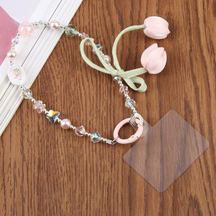Correa de muñeca para teléfono con colgante de flor de tulipán y almohadilla de sujeción para mujeres y niñas.
