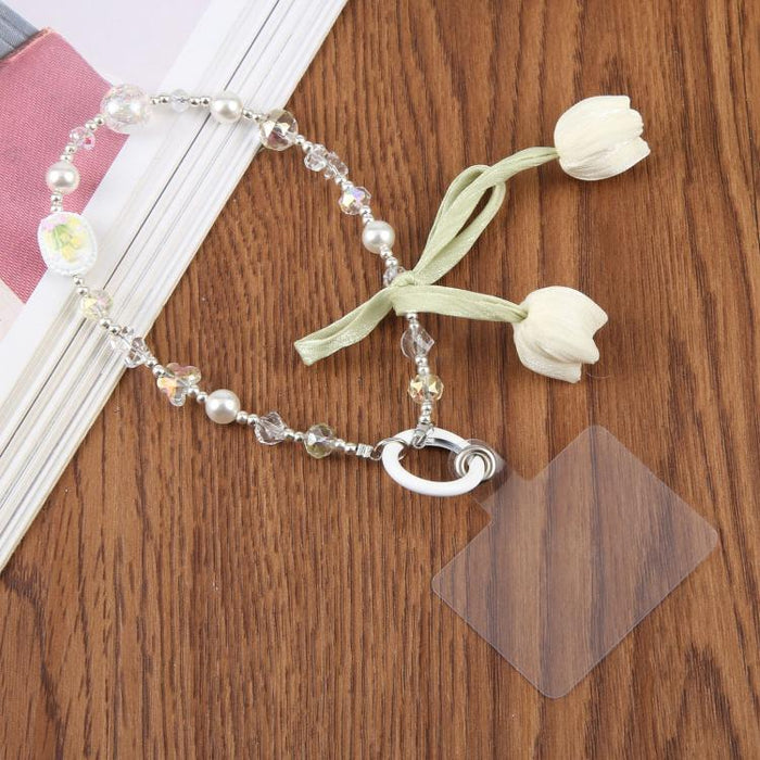 Correa de muñeca para teléfono con colgante de flor de tulipán y almohadilla de sujeción para mujeres y niñas.