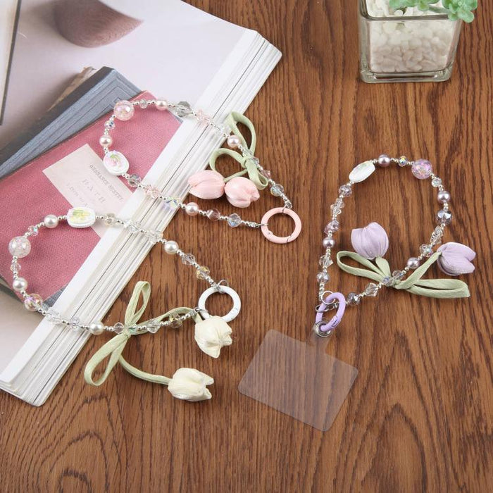 Correa de muñeca para teléfono con colgante de flor de tulipán y almohadilla de sujeción para mujeres y niñas.