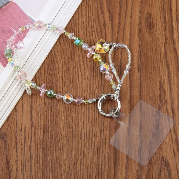 Pulsera con colgante de teléfono con cuentas y almohadilla de sujeción para mujeres y niñas.