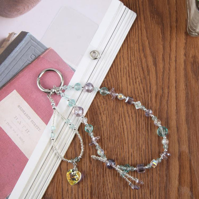 Pulsera con colgante de teléfono con cuentas y almohadilla de sujeción para mujeres y niñas.