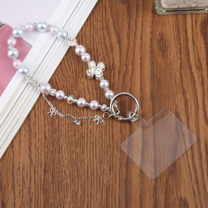 Pulsera con colgante de trébol de cuatro hojas, borla y cuentas, con almohadilla de sujeción para mujer y niña.