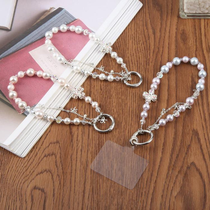 Pulsera con colgante de trébol de cuatro hojas, borla y cuentas, con almohadilla de sujeción para mujer y niña.