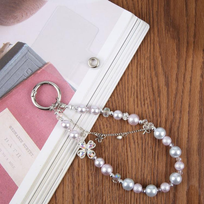 Pulsera con colgante de trébol de cuatro hojas, borla y cuentas, con almohadilla de sujeción para mujer y niña.