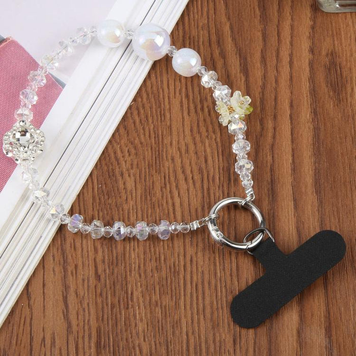 Pulsera con colgante de trébol de cuatro hojas y almohadilla de sujeción para mujer y niña.