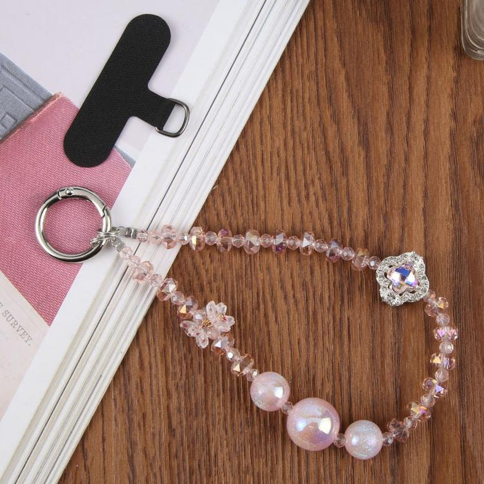 Pulsera con colgante de trébol de cuatro hojas y almohadilla de sujeción para mujer y niña.