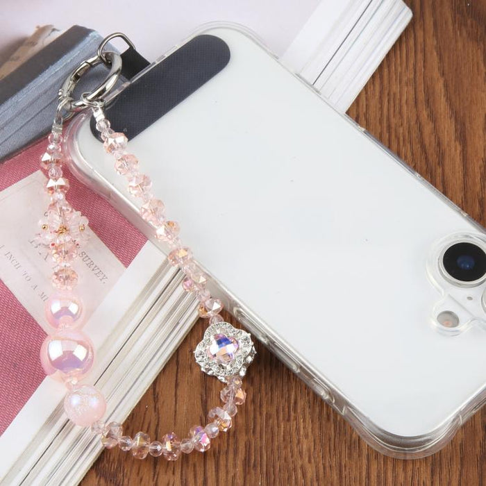Pulsera con colgante de trébol de cuatro hojas y almohadilla de sujeción para mujer y niña.