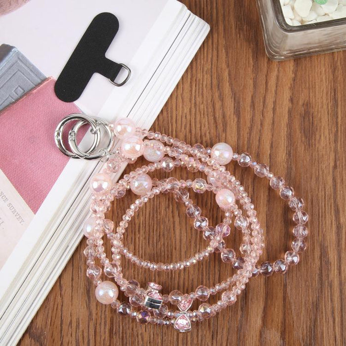 Colgante para teléfono con cadena de cuentas y lazo, con almohadilla de sujeción para mujeres y niñas.