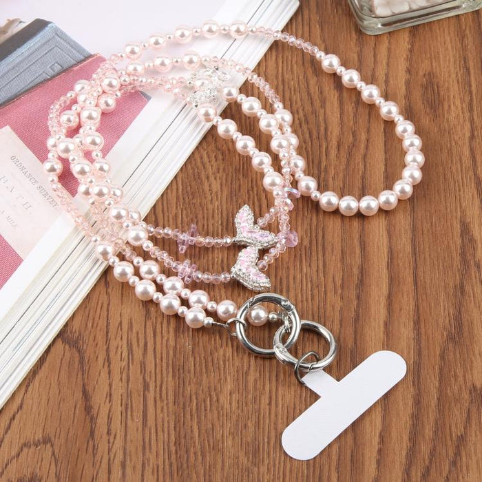 Colgante para teléfono con cadena de cuentas en forma de cola de pez y almohadilla de sujeción para mujeres y niñas.