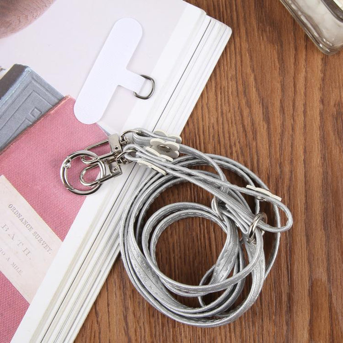 Cordón para teléfono con correa de cuero ajustable con decoración floral y almohadilla de sujeción para hombre y mujer.