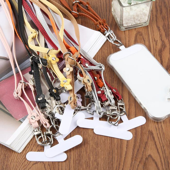 Cordón para teléfono con correa de cuero ajustable con decoración floral y almohadilla de sujeción para hombre y mujer.