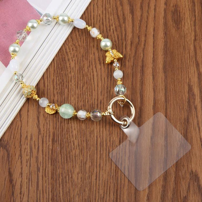 Cadena corta de cuentas con forma de mariposa ojo de gato y correa de muñeca con almohadilla de sujeción para mujeres y niñas.