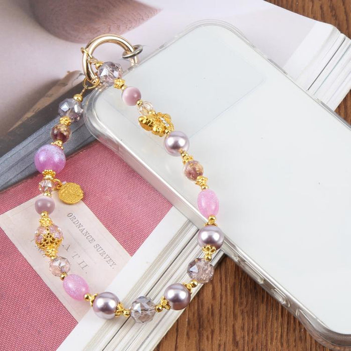 Cadena corta de cuentas con forma de mariposa ojo de gato y correa de muñeca con almohadilla de sujeción para mujeres y niñas.