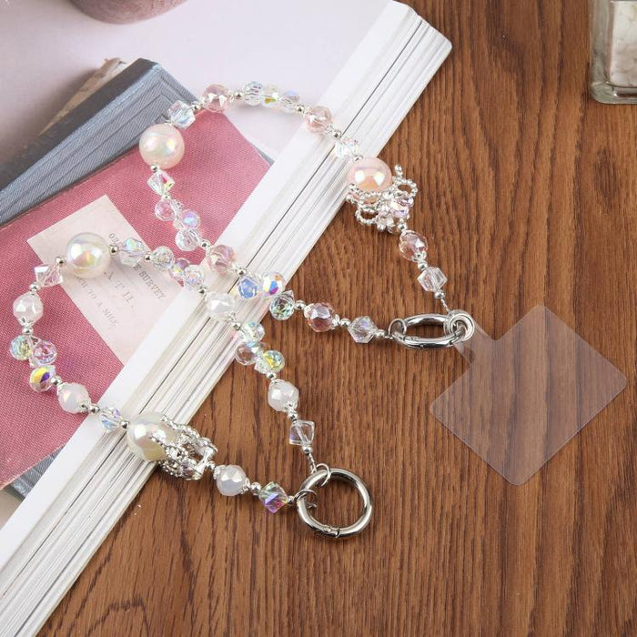 Pulsera con colgante de teléfono y cordón de sujeción con cuentas de burbujas de camelia para mujeres y niñas.