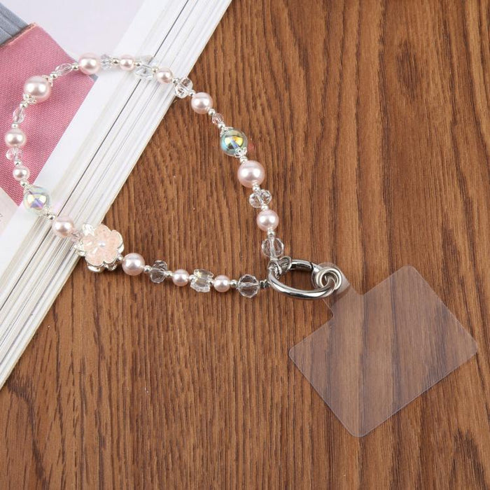 Cadena corta de cuentas con colgante para teléfono y correa de muñeca con almohadilla de sujeción para mujeres y niñas.