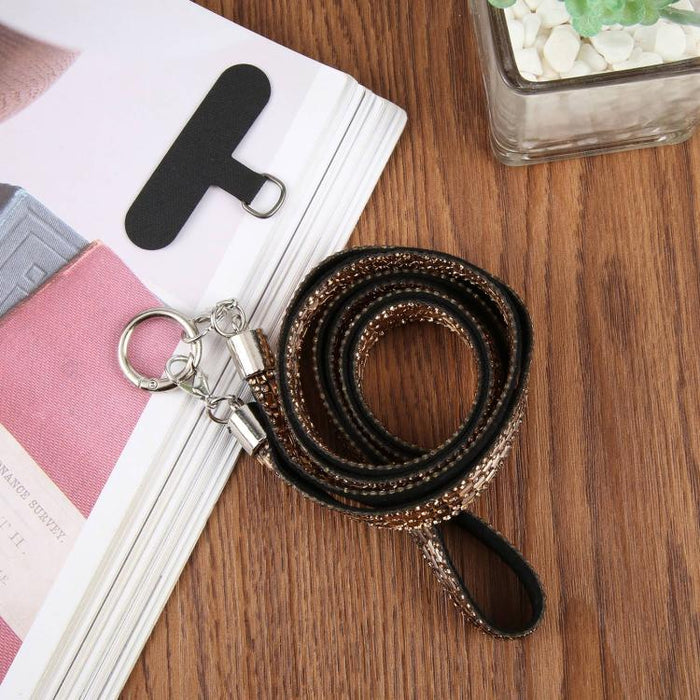 Cordón para teléfono con diamantes de imitación brillantes y almohadilla