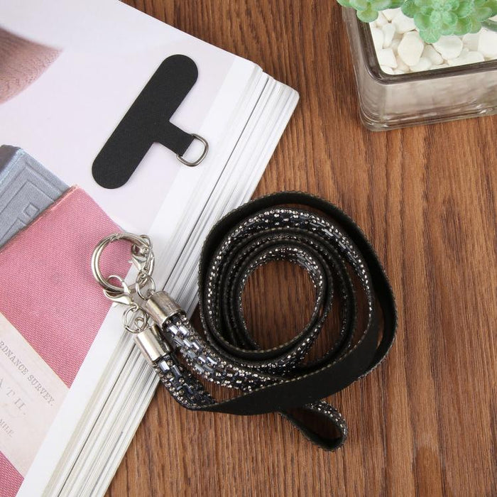 Cordón para teléfono con diamantes de imitación brillantes y almohadilla