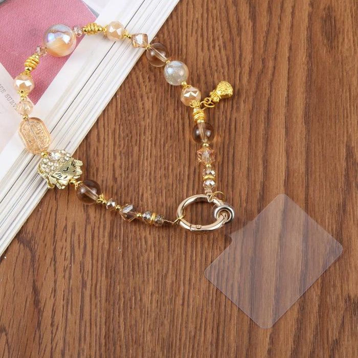 Cordón para teléfono con forma de gato de la suerte incrustado de diamantes