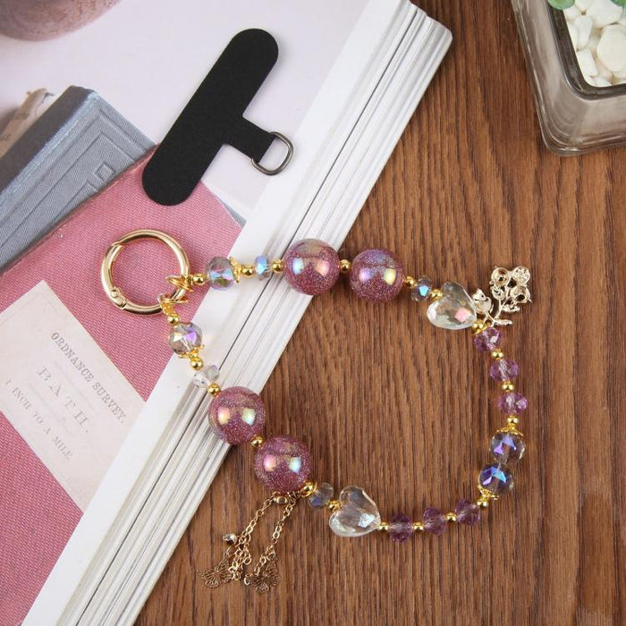 Pulsera con colgante de flores coloridas y cuentas, con almohadilla de sujeción para mujeres y niñas.