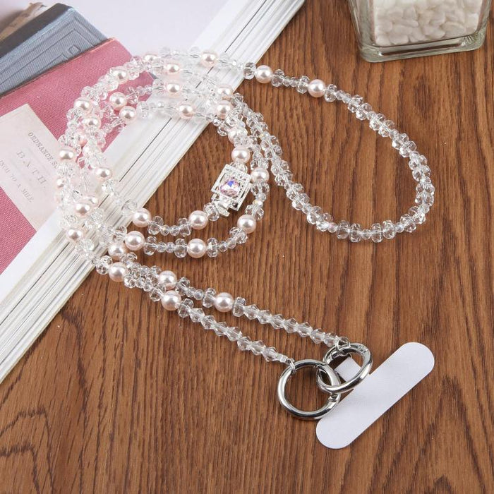 Colgante para teléfono con forma de frasco de perfume y cuentas, con cordón cruzado y almohadilla de sujeción.
