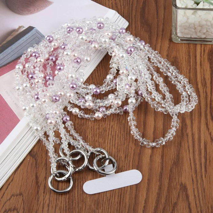 Colgante para teléfono con forma de frasco de perfume y cuentas, con cordón cruzado y almohadilla de sujeción.