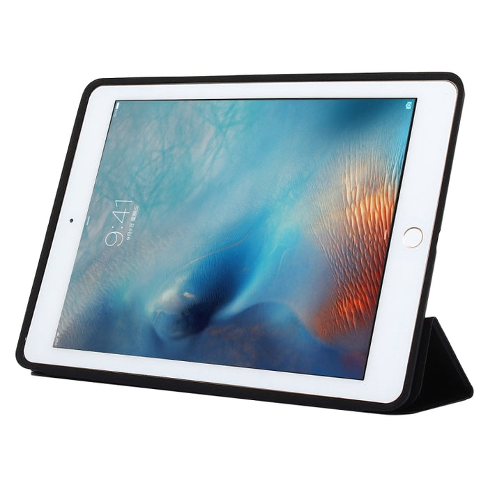 Funda de cuero de color sólido con tapa horizontal con soporte plegable triple y función de activación / suspensión para iPad Pro de 9,7 pulgadas